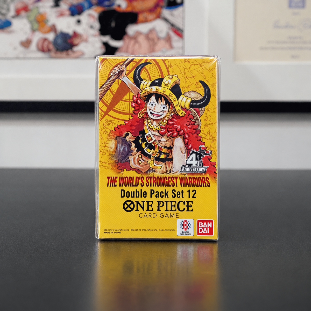 A Yellow boxOne Piece Card Game: Double Pack Set (DP-12) featuring luffy