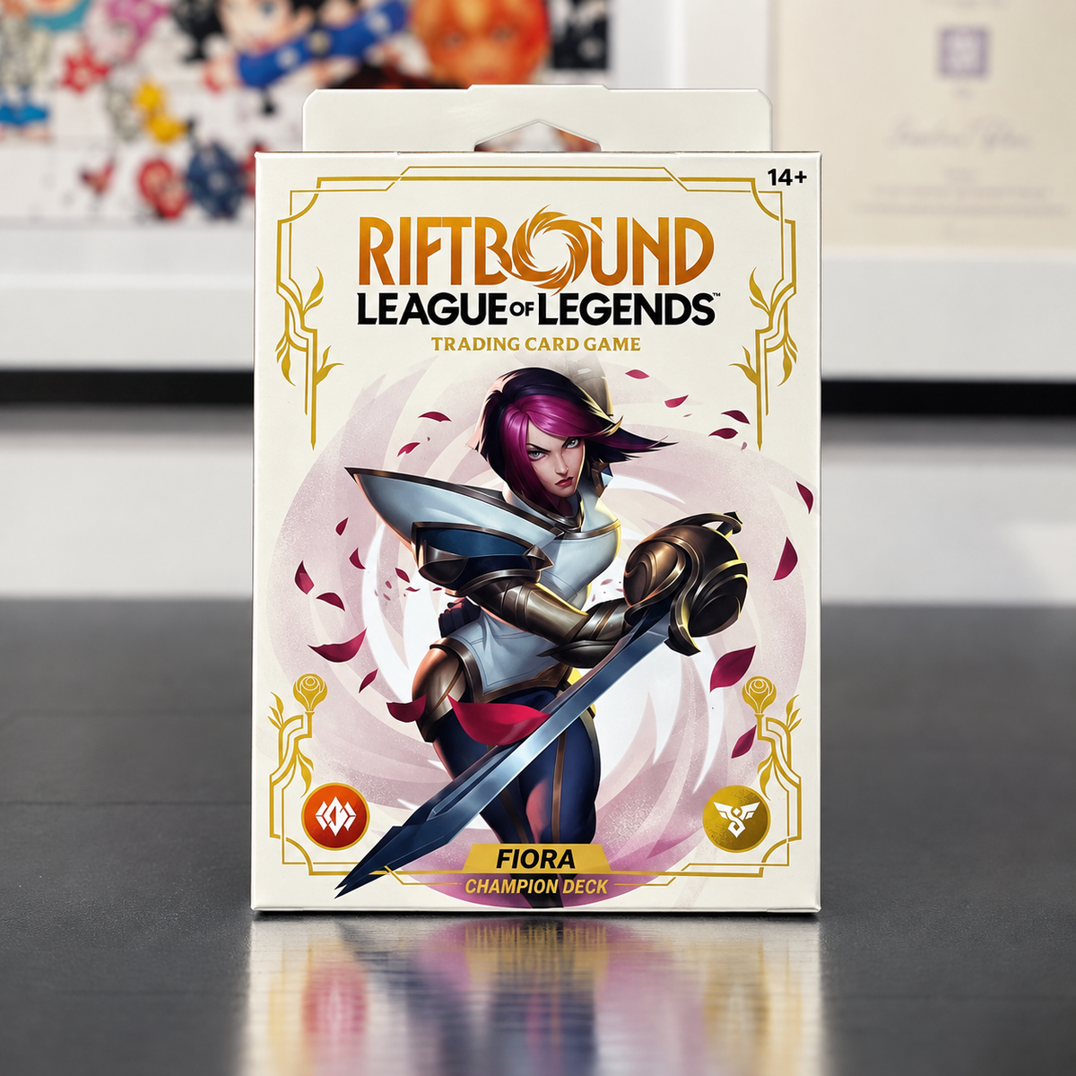 Riftbound League of Legends Trading Card Game: Fiora Champion Deck box, featuring a white background with gold borders and an illustration of Fiora holding a sword.