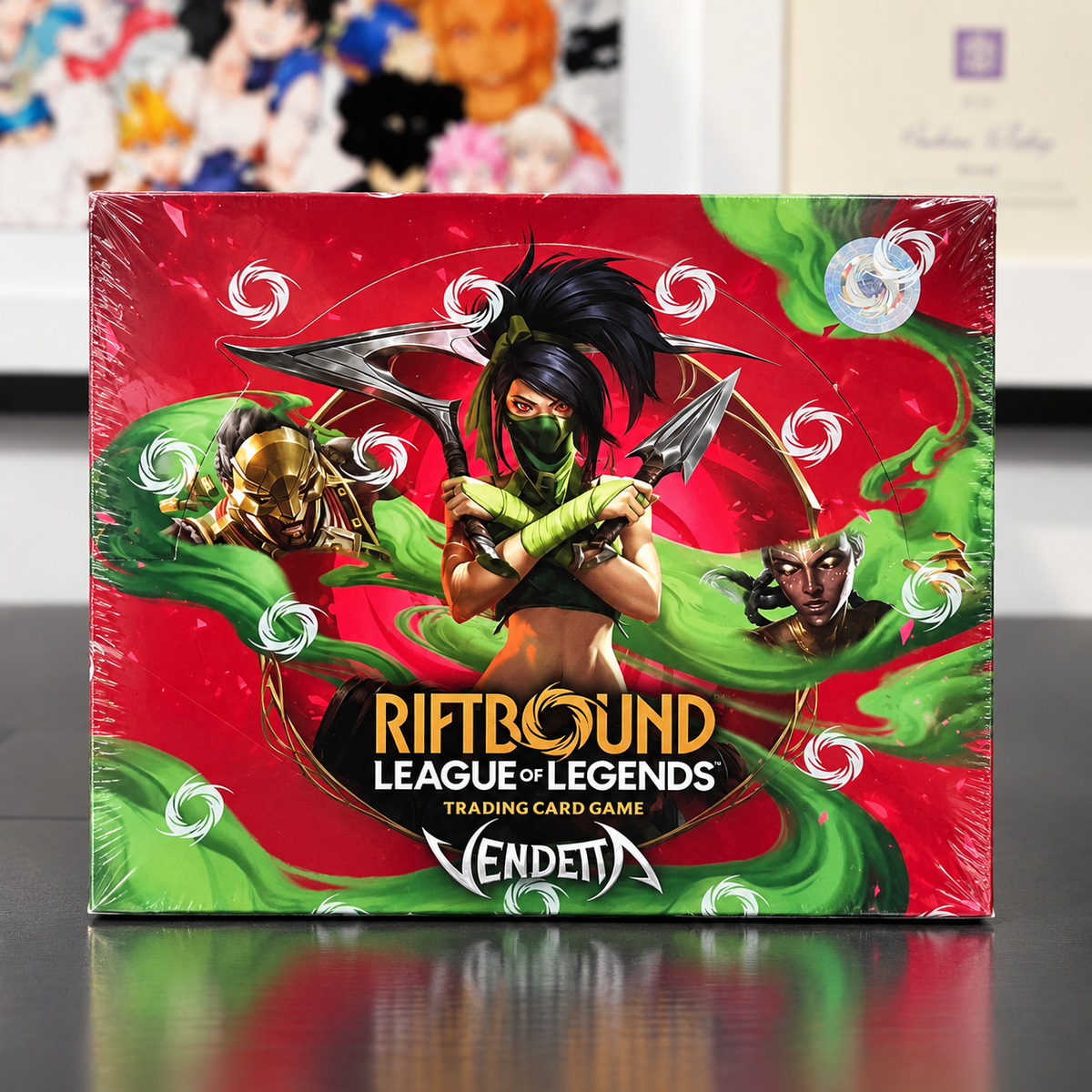 Riftbound League of Legends trading card game box by Vendetta, featuring a red and green design with character illustrations
